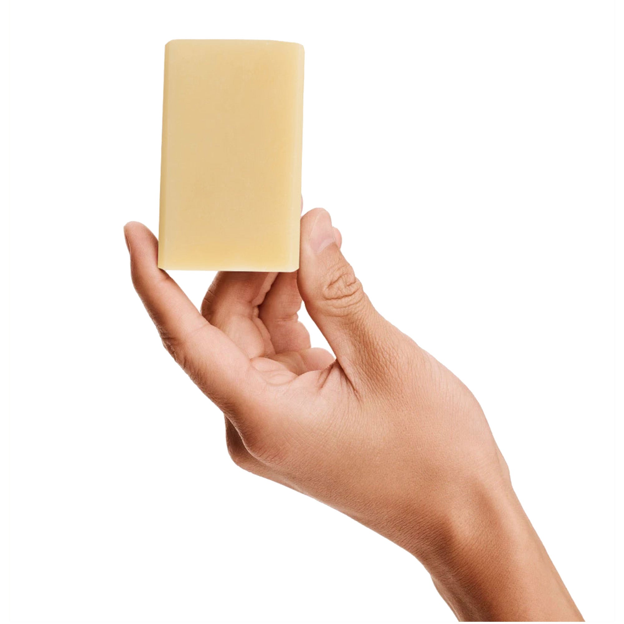 Image of a model holding a bar of Antü Refreshing Soap.