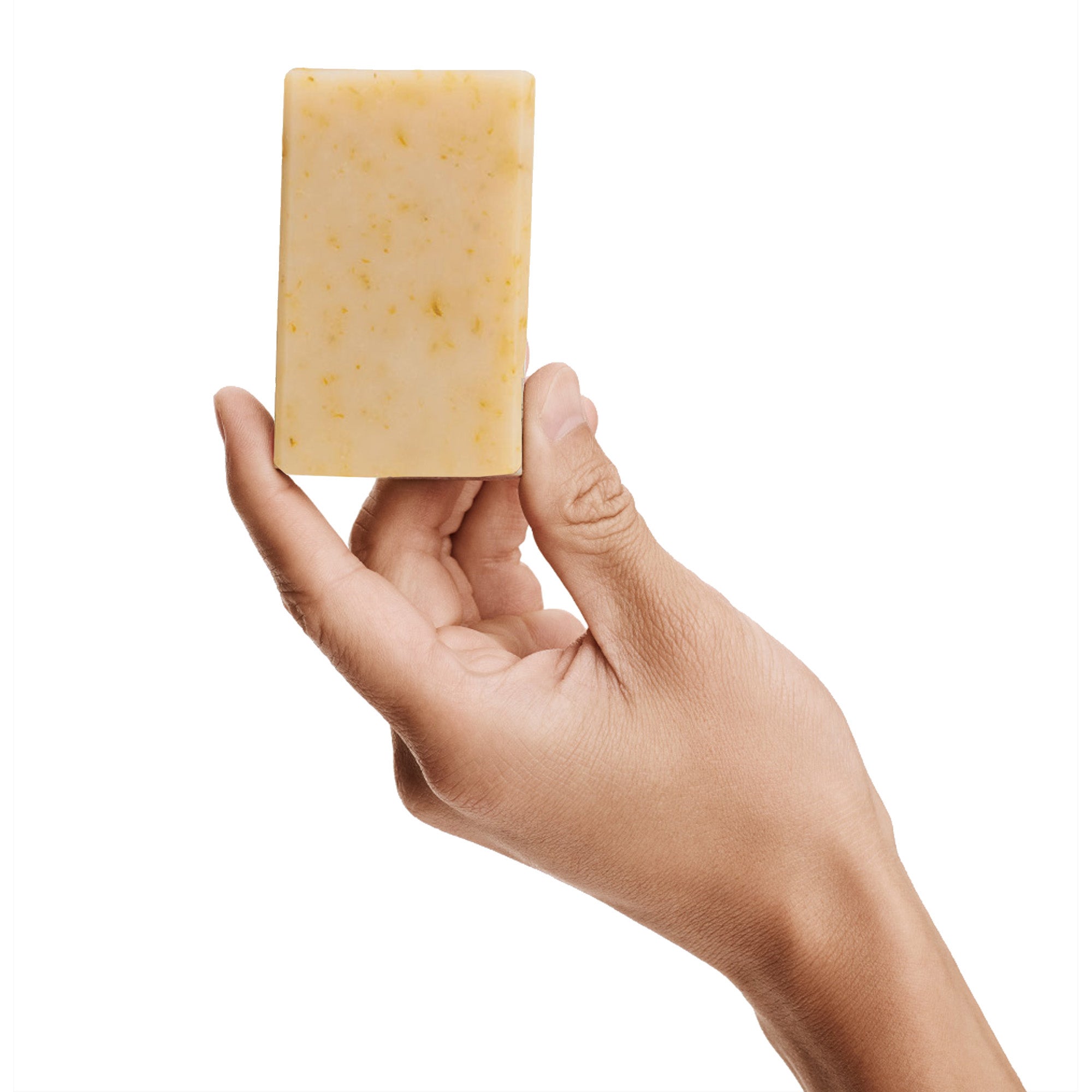 Bia Unscented soap held by a hand.
